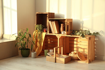 Wooden boxes with stylish decor in room