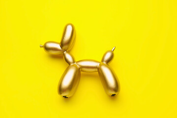 Stylish figurine of balloon dog on color background