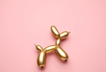 Stylish figurine of balloon dog on color background