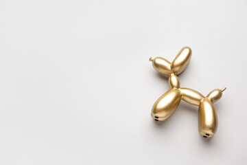 Stylish figurine of balloon dog on grey background