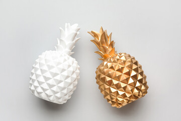 Stylish pineapples on grey background