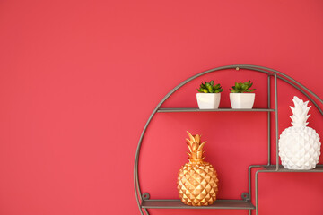 Stylish decor on shelf hanging on color wall