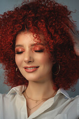 White European girl with afro curls, beautiful casual makeup. Large portrait of a girl with red hair