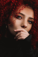 White European girl with afro curls, beautiful casual makeup. Large portrait of a girl with red hair