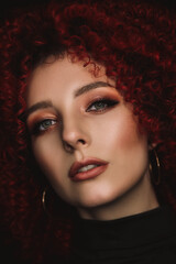 White European girl with afro curls, beautiful casual makeup. Large portrait of a girl with red hair