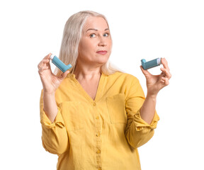 Mature woman with inhalers on white background