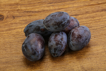 Purple sweet ripe plum heap