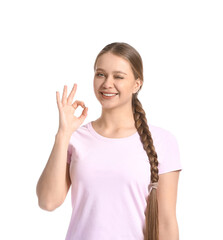 Beautiful smiling young woman showing OK on white background