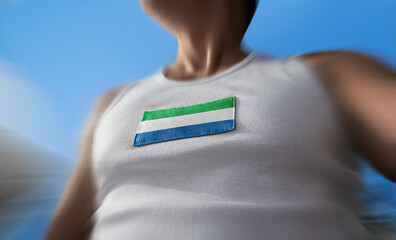 The national flag of Sierra Leone on the athlete's chest