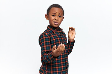 Isolated shot of confident self assured African schoolboy showing confidence and readiness to...