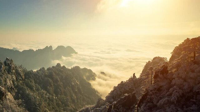 Sunrise time lapse looking out over a sea of fog at the Yellow Mountains (Huangshan) in China