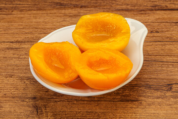 Naklejka na ściany i meble Marinated peaches fruit in the bowl