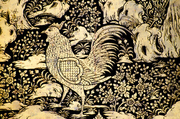 Golden chicken murals on black background. Wat Krean Kathin Lopburi Province Thailand.