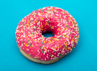 Red donut on a blue background.