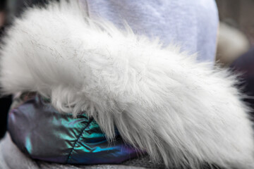 Collar of white fur on a jacket.