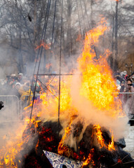 Lipetsk, Russia - March 14, 2021: Burning effigy for the coming of spring. Pagan Russian holiday Maslenitsa