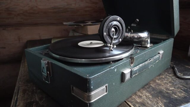 Close up closeup Old Phonograph gramophone patephone retro interior with rotating vinyl record LP. High quality 4k footage