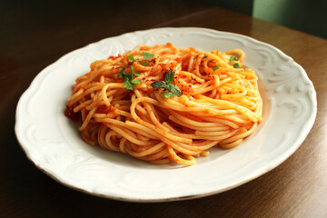 Fresh cooked spaghetti with tomato sauce , top view