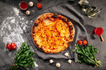 Top view on neopolitan fresh baked margherita pizza on the grey background