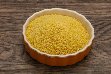 Raw cous cous heap in the bowl
