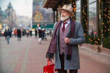bearded grandfather walking in the street