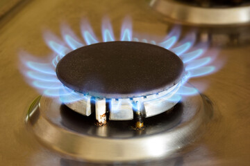Kitchen gas stove with burning hot burner
