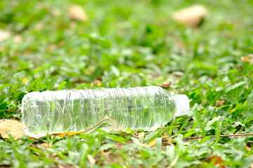 bottle of water in green natural background and space