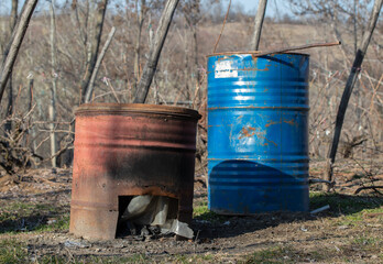 a wood oven made of an old oil barrel