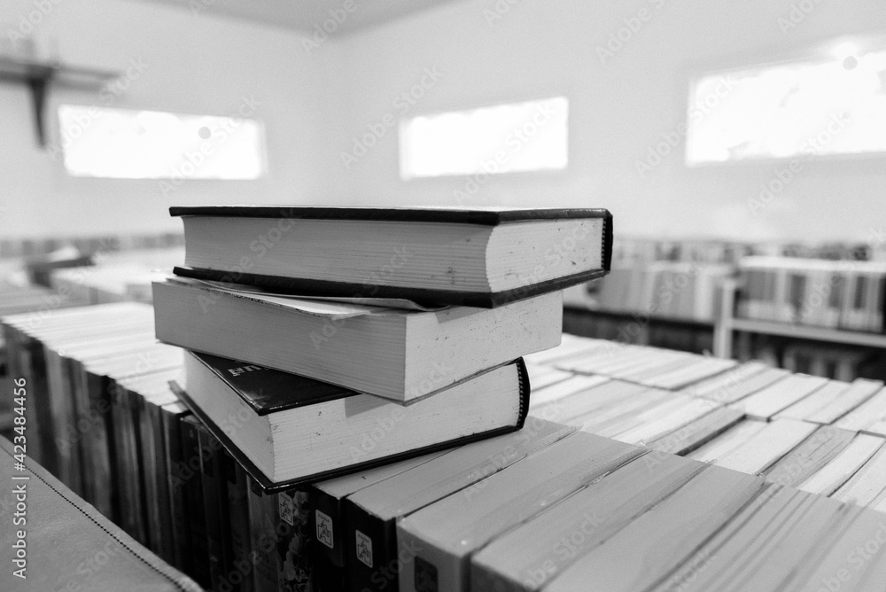 Poster vintage retro bookshelf in public library with many books. book stack in the library room for educat