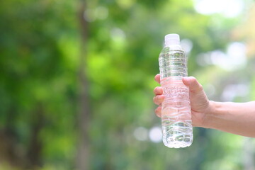 hand holding water bottle