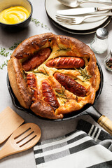 Toad in the hole, Sausage Toad, traditional English dish of sausages in Yorkshire pudding batter. 