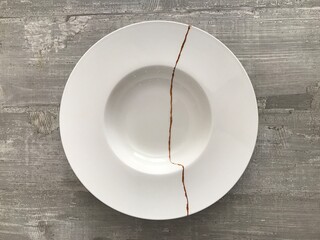 A broken bowl repaired with gold dust following the Japanese art of kintsugi