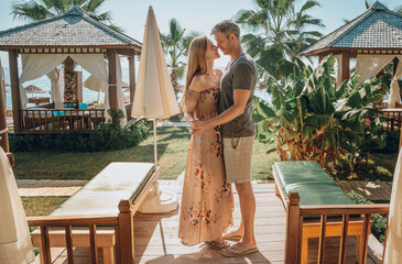 tropical vacation couple in spa hotel