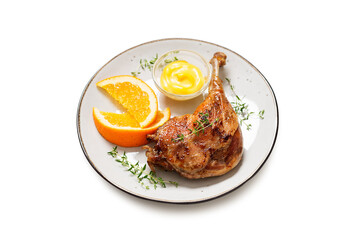 Duck leg confit served with potato chips and mustard sauce .Traditional french cuisine. isolated on white background