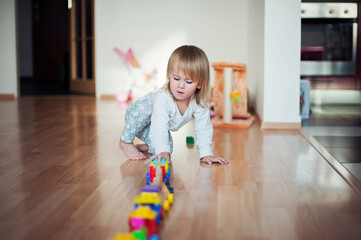 Little girl playing with train