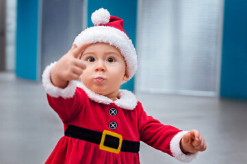 Beautiful little baby in Santa costume