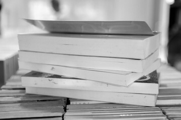 Vintage retro bookshelf in public library with many books. Book stack in the library room for...