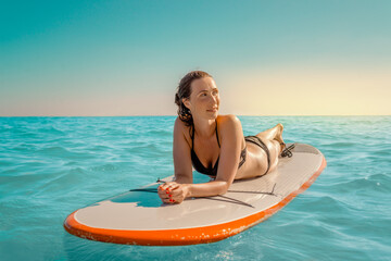 paddeling female on the sea