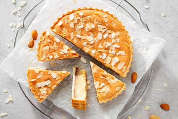 Strawberry Almond Bakewell Tart. Traditional British cuisine. Light gray background,top view.