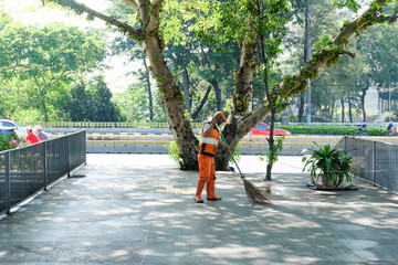 Jakarta, Indonesia - March 28th 2021: A street cleaner in Jakarta