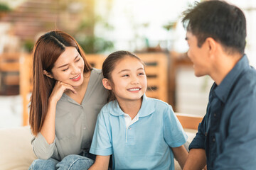 Parent having serious conversation with  daughter at home