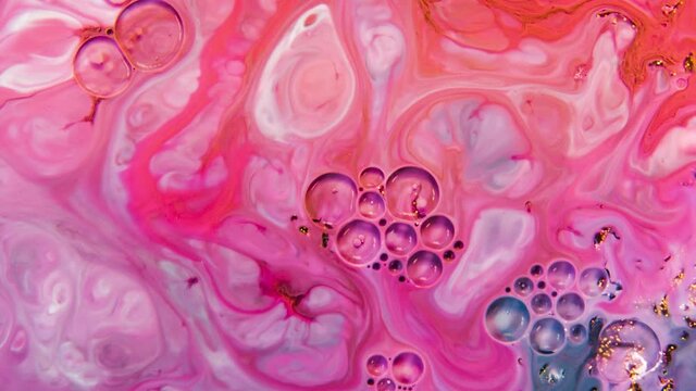 Abstract Colors in a moving video background. Multicolored beautiful oil paints in fantastic motion. Chaotic Movement of bubbles in a dark background.