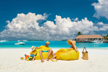 Family with three year old boy on beach