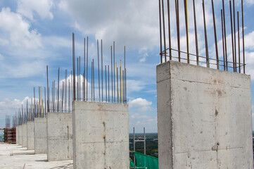 Steel reinforce in concrete column.Steel grid on the construction site.Reinforcement of concrete work. Using steel wire for securing steel bars with wire rod for reinforcement of concrete