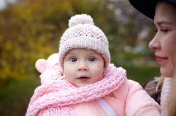 Beautiful baby girl with mother outdoors. Family outdoor
