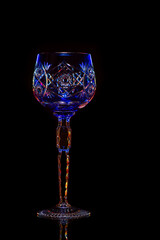 Beautiful crystal wine glass isolated on black.