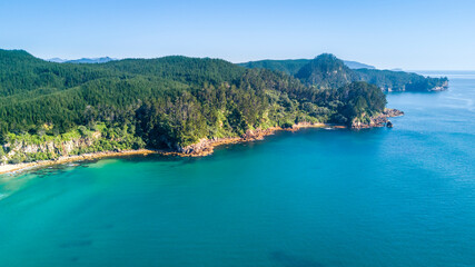 Aerial view of a beautiful harbour with rocky coastline. Coromandel, New Zealand.