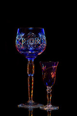 Beautiful crystal wine glasses isolated on black.