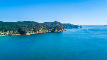 Aerial view of a beautiful harbour with rocky coastline. Coromandel, New Zealand.