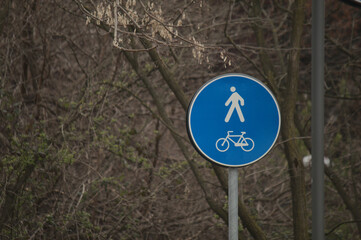 an Italian road sign by day	